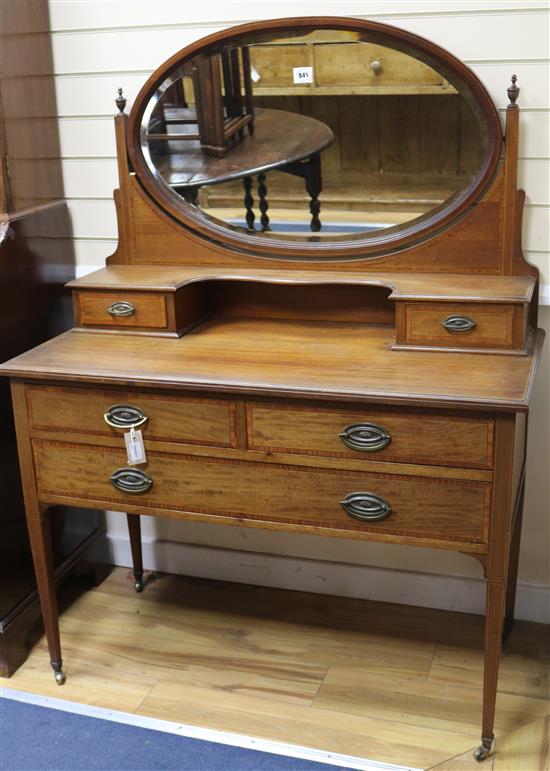 An Edwardian mahogany inlaid dressing table W.107cm